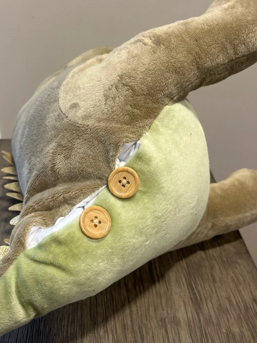 Dinosaur plush with pocket for storing treasures